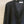 Load image into Gallery viewer, Boxig kofta i lyxig merionoull från Dinadi. V-ringad,&nbsp;hornknappar och ribbade muddar.

Färg: Onyx grå

Material: Tillverkad av 100 % extra fin merinoull
