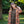 Load image into Gallery viewer, Lieblings kimono Gro i tyget Thalia. En lång lyxig kimono med fina kragdetaljer. Band att knyta i midjan.&nbsp;I kollektion Ridå har vi gjort Gro lite kortare än tidigare och i två storlekar. Tidigare onesize är nu S/M.&nbsp;

Färg: Blommor i grönt, gult, brunt och vitt på orange botten.

Material: 51% EcoVero, 49% viskos från Frankrike.
