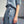 Load image into Gallery viewer, kjol Ina i lyxig cupro från Liebling. Ina är den perfekta kjolen! Slät linning mitt fram, resår i sidorna och blixtlås bak. Tre veck på vardera sida fram och bak. Fickor i sidorna. Hällor och brett band att knyta i midjan.  Färg: Ljusblå Material: 100% cupro Materialursprung: Detta är ett resttyg från det svenska företaget Rekotex
