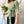 Load image into Gallery viewer, Lieblings omlott-topp Myra Kvitten. V-ringad, trekvartsärm och brett knytband i sidorna. Färg: Kvittengula och vita blommor, skogsgröna blad och svarta stjälkar på pastellgrön botten. Material: 51% EcoVero, 49% viskos från Frankrike.
