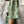 Load image into Gallery viewer, Lieblings klänning Noor Kvitten! Rak modell, krage med slag, knappar fram och fickor i sidorna. Litet uppvik vid ärmslut. Band medföljer. Färg: Kvittengula och vita blommor, skogsgröna blad och svarta stjälkar på pastellgrön botten. Material: 51% EcoVero, 49% viskos från Frankrike.
