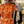 Load image into Gallery viewer, Klänning Svavel från Bric-a-brac. Bandkrage med rynk, knappslå med fem pärlemorknappar, fickor i sidorna. Band medföljer.  Färg: Vita och gula blommor på korallorange botten.   Material: 100% bomull
