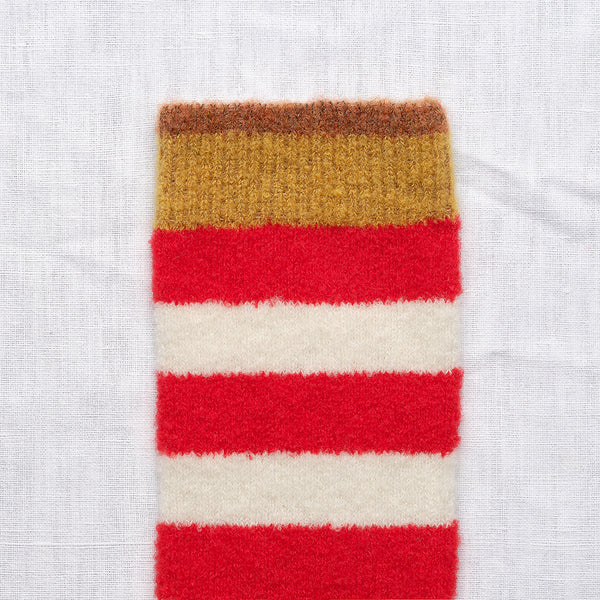 Ljuvliga ullstrumpor från franska Bonne Maison. Onesize, 36-42.&nbsp;

Färg: Randiga strumpor i rött, vitt. Ockrabrun kant och kanelbrun tå.

Material: 62% merinoull, 37% polyamid, 1% elastan.

Skötselråd: 30 grader i ulltvätt

Tillverkad i: Portugal