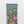 Load image into Gallery viewer, Strumpor Flower Arctic från franska Bonne Maison. De är tillverkade av finaste egyptiska bomull och en dubbeltrådig elastan. Som konstverk på fötterna!   Färg: Rosa, gula, ljusrosa och mossgröna blommor på artisk blå bakgrund med absintgrön tå. 
